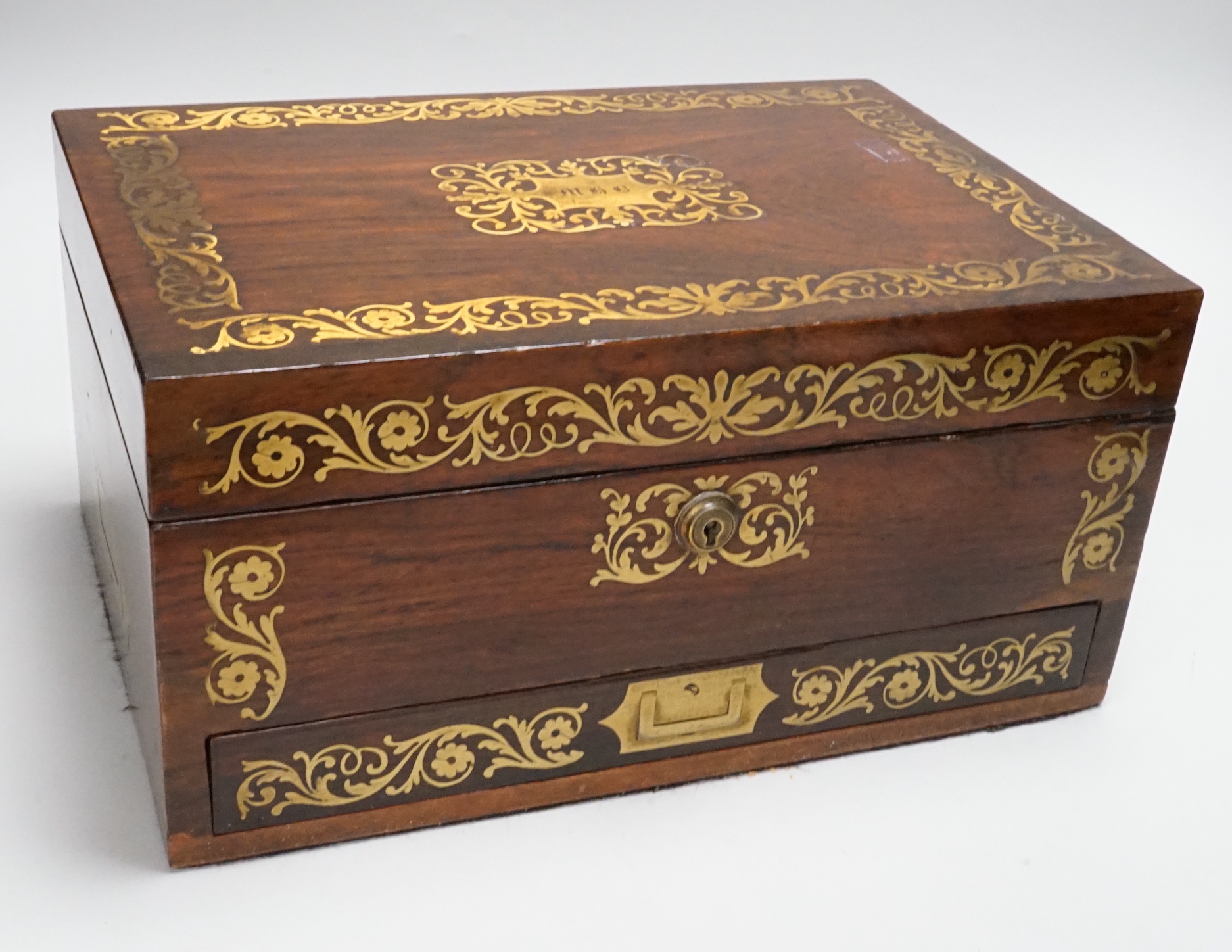 An early 19th century brass inlaid rosewood vanity/jewellery basket and contents, 33cm wide